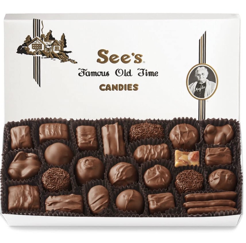 An open box of See’s Candies chocolates, with an assortment of milk and dark chocolate pieces—just like those in my favorite chocolate recipes—neatly arranged in brown paper cups inside a white box labeled "See's Famous Old Time Candies.
